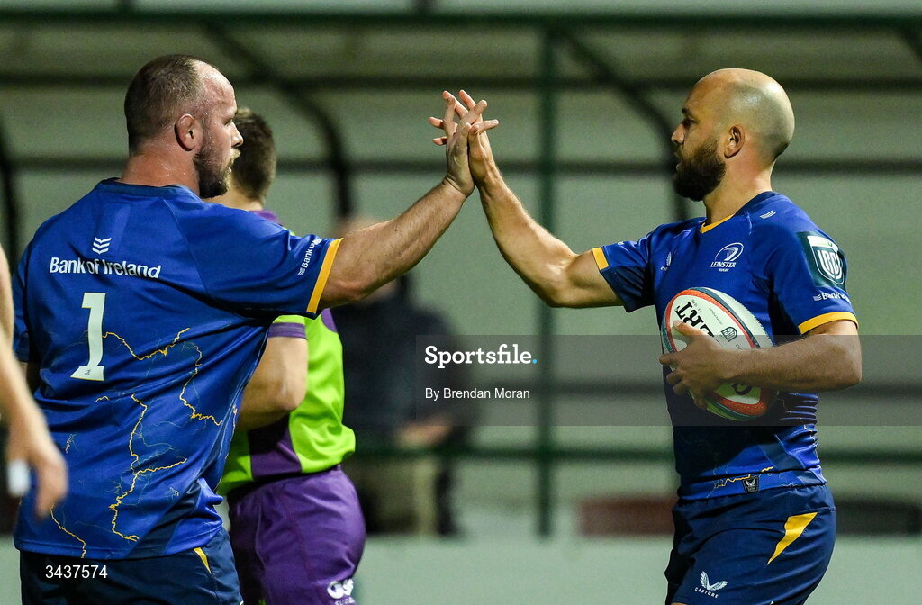 25 April 2026; Jamison Gibson-Park of Leinster, right, celebrates with teammate Ed Byrne, after scoring their side's third try during the United Rugby Championship match between Benetton and Leinster at Stadio Monigo in Treviso, Italy. Photo by Brendan Moran/Sportsfile