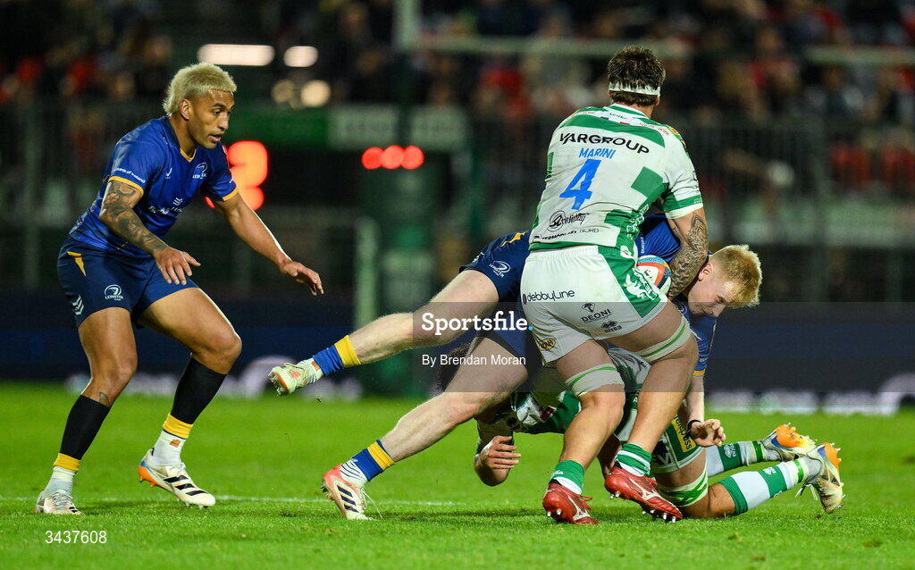 25 April 2026; Jamie Osborne of Leinster is tackled by Giulio Marini and Michele Lamaro of Benetton during the United Rugby Championship match between Benetton and Leinster at Stadio Monigo in Treviso, Italy. Photo by Brendan Moran/Sportsfile