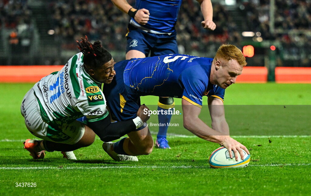 25 April 2026; Ciarán Frawley of Leinster scores his side's fourth try despite the tackle of Paolo Odogwu of Benetton during the United Rugby Championship match between Benetton and Leinster at Stadio Monigo in Treviso, Italy. Photo by Brendan Moran/Sportsfile