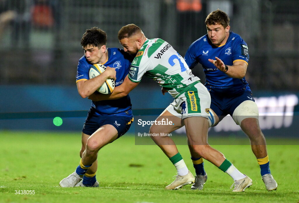 25 April 2026; Jimmy O'Brien of Leinster, supported by teammate Scott Penny, right, is tackled by Andy Uren of Benetton during the United Rugby Championship match between Benetton and Leinster at Stadio Monigo in Treviso, Italy. Photo by Brendan Moran/Sportsfile