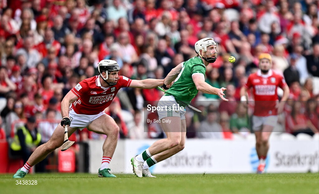 26 April 2026; Cian Lynch of Limerick in action against Barry Walsh of Cork during the Munster GAA Senior Hurling Championship Round 2 match between Cork and Limerick at SuperValu Páirc Uí Chaoimh in Cork. Photo by Seb Daly/Sportsfile