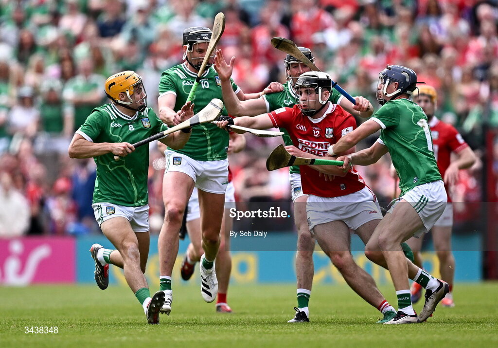 26 April 2026; Barry Walsh of Cork is tackled by Limerick players, from left, Adam English, Diarmaid Byrnes, Gearóid Hegarty, and David Reidy, during the Munster GAA Senior Hurling Championship Round 2 match between Cork and Limerick at SuperValu Páirc Uí Chaoimh in Cork. Photo by Seb Daly/Sportsfile