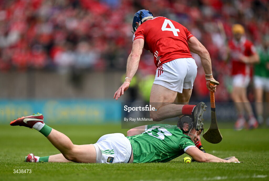 26 April 2026; Peter Casey of Limerick is tackled by Seán O'Donoghue of Cork during the Munster GAA Senior Hurling Championship Round 2 match between Cork and Limerick at SuperValu Páirc Uí Chaoimh in Cork. Photo by Ray McManus/Sportsfile