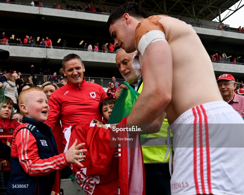 26 April 2026; Darragh Fitzgibbon of Cork presents his match jersey to supporter Tomás Óg Delaney who was accidentally struck by a hurley after their last Munster championship hurling match against Tipperary, after the Munster GAA Senior Hurling Championship Round 2 match between Cork and Limerick at SuperValu Páirc Uí Chaoimh in Cork. Photo by Tom Beary/Sportsfile
