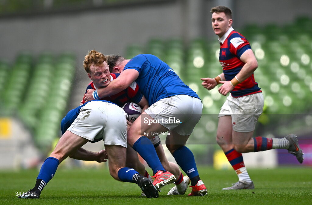 26 April 2026; Hugh Cooney of Clontarf FC is tackled by Mick O'Gara, left, and Thomas O'Reilly of St Mary's College RFC during the Energia Men's All-Ireland League Division 1A final match between Clontarf FC and St Mary's College RFC at the Aviva Stadium in Dublin. Photo by Tyler Miller/Sportsfile