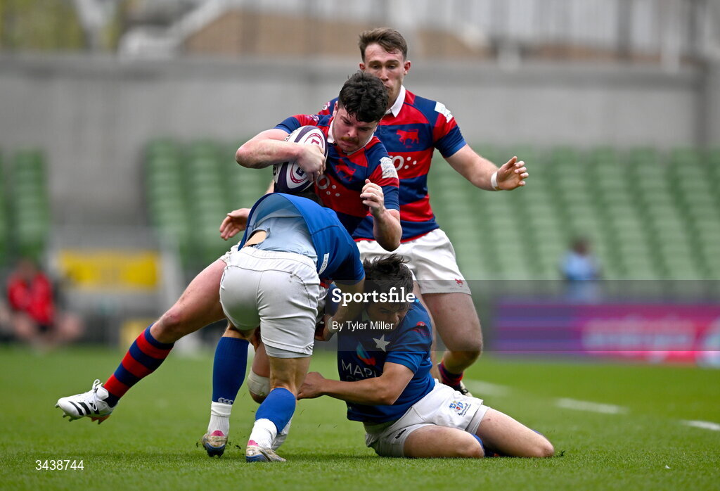 26 April 2026; Aaron Coleman of Clontarf FC is tackled by Ramirez Leandro, left, and Robert Gilsenan of St Mary's College RFC during the Energia Men's All-Ireland League Division 1A final match between Clontarf FC and St Mary's College RFC at the Aviva Stadium in Dublin. Photo by Tyler Miller/Sportsfile