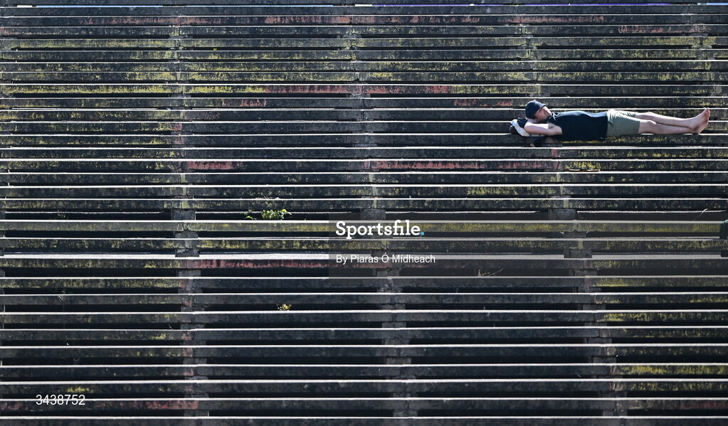 26 April 2026; A spectator takes a rest on the terrace behind one of the goals before the Connacht GAA Football Senior Championship semi-final match between Mayo and Roscommon at Hastings Insurance MacHale Park in Castlebar, Mayo. Photo by Piaras Ó Mídheach/Sportsfile