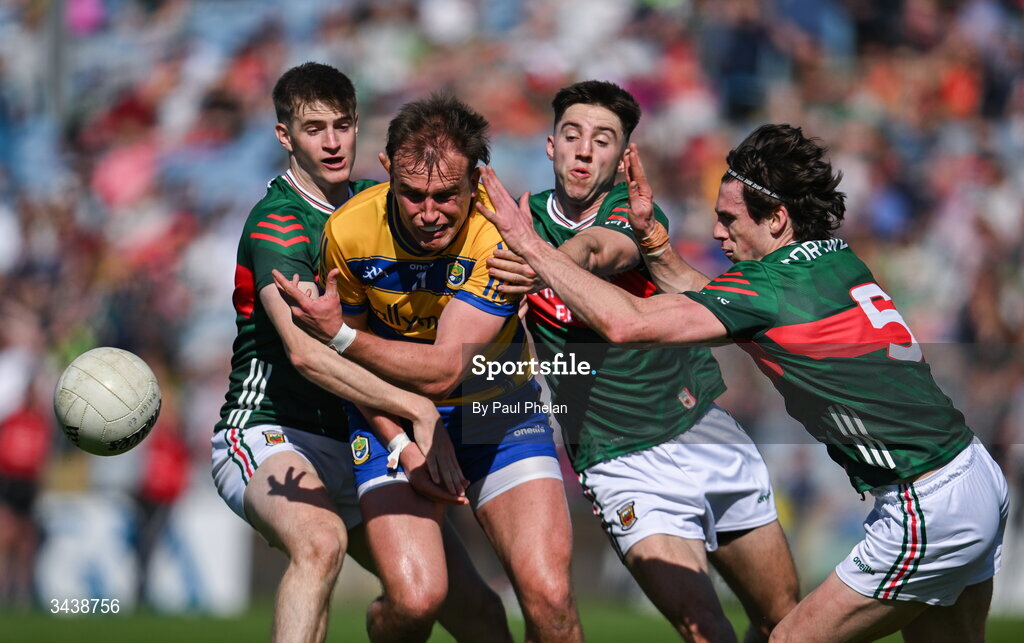 26 April 2026; Enda Smith of Roscommon is tackled by Rory Brickenden, Enda Hession and Sam Callinan of Mayo during the Connacht GAA Football Senior Championship semi-final match between Mayo and Roscommon at Hastings Insurance MacHale Park in Castlebar, Mayo. Photo by Paul Phelan/Sportsfile