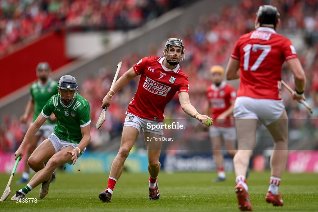 26 April 2026; Mark Coleman hand passes to Cork team-mate Damien Cahalane during the Munster GAA Senior Hurling Championship Round 2 match between Cork and Limerick at SuperValu Páirc Uí Chaoimh in Cork. Photo by Tom Beary/Sportsfile
