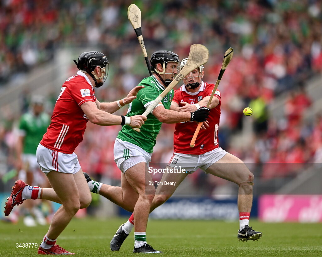 26 April 2026; Darragh O'Donovan of Limerick is tackled by Damien Cahalane, left, and Tommy O'Connell of Cork during the Munster GAA Senior Hurling Championship Round 2 match between Cork and Limerick at SuperValu Páirc Uí Chaoimh in Cork. Photo by Tom Beary/Sportsfile