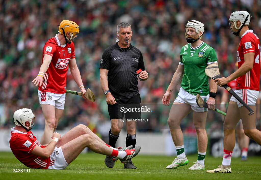 26 April 2026; Tim O'Mahony of Cork on the ground as referee James Owens approaches before he issues Cian Lynch of Limerick a Red Card during the Munster GAA Senior Hurling Championship Round 2 match between Cork and Limerick at SuperValu Páirc Uí Chaoimh in Cork. Photo by Ray McManus/Sportsfile