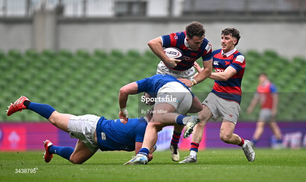 26 April 2026; Daniel Hawkshaw of Clontarf FC is tackled by Dan Goggin, centre, and Thomas O'Reilly of St Mary's College RFC during the Energia Men's All-Ireland League Division 1A final match between Clontarf FC and St Mary's College RFC at the Aviva Stadium in Dublin. Photo by Tyler Miller/Sportsfile