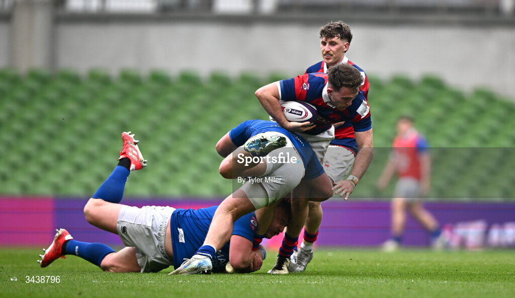 26 April 2026; Daniel Hawkshaw of Clontarf FC is tackled by Dan Goggin, centre, and Thomas O'Reilly of St Mary's College RFC during the Energia Men's All-Ireland League Division 1A final match between Clontarf FC and St Mary's College RFC at the Aviva Stadium in Dublin. Photo by Tyler Miller/Sportsfile
