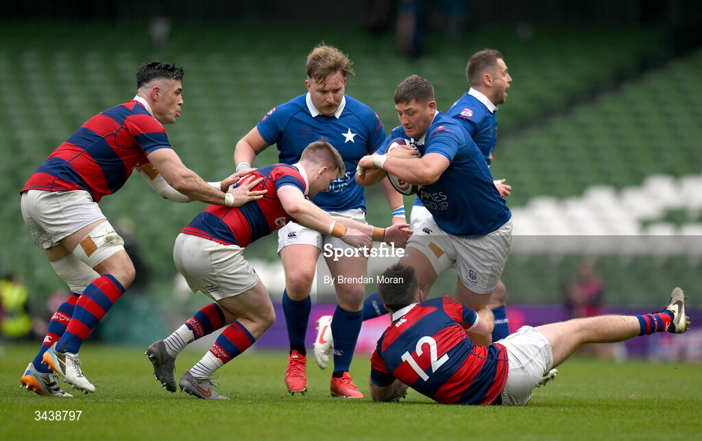 26 April 2026; Dan Goggin of St Mary's College RFC is tackled by Conor Kelly and Daniel Hawkshaw of Clontarf FC during the Energia Men's All-Ireland League Division 1A final match between Clontarf FC and St Mary's College RFC at the Aviva Stadium in Dublin. Photo by Brendan Moran/Sportsfile