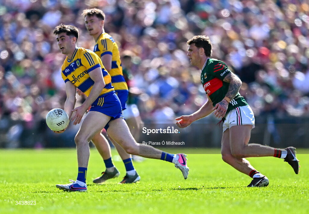 26 April 2026; Senan Lambe of Roscommon in action against Jordan Flynn of Mayo during the Connacht GAA Football Senior Championship semi-final match between Mayo and Roscommon at Hastings Insurance MacHale Park in Castlebar, Mayo. Photo by Piaras Ó Mídheach/Sportsfile
