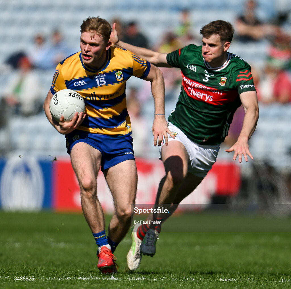 26 April 2026; Robert Heneghan  of Roscommon in action against Rory Brickenden of Mayo during the Connacht GAA Football Senior Championship semi-final match between Mayo and Roscommon at Hastings Insurance MacHale Park in Castlebar, Mayo. Photo by Paul Phelan/Sportsfile