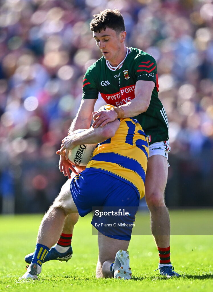 26 April 2026; Darragh Heneghan of Roscommon is tackled by Jack Coyne of Mayo during the Connacht GAA Football Senior Championship semi-final match between Mayo and Roscommon at Hastings Insurance MacHale Park in Castlebar, Mayo. Photo by Piaras Ó Mídheach/Sportsfile