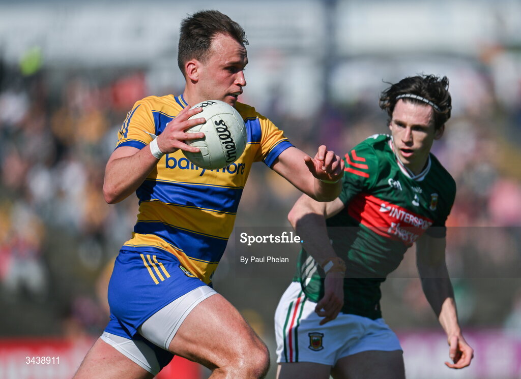 26 April 2026; Enda Smith of Roscommon in action against Sam Callinan of Mayo during the Connacht GAA Football Senior Championship semi-final match between Mayo and Roscommon at Hastings Insurance MacHale Park in Castlebar, Mayo. Photo by Paul Phelan/Sportsfile