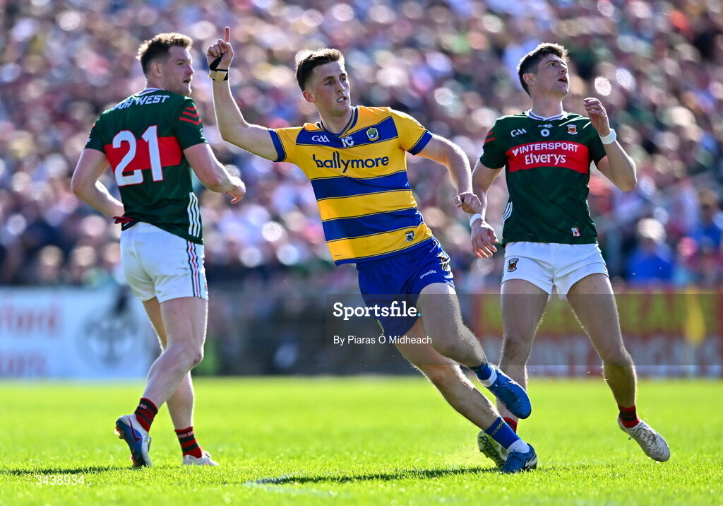 26 April 2026; Dylan Ruane of Roscommon celebrates scoring a point, as Mayo players Matthew Ruane, left, and Conor Loftus look on, during the Connacht GAA Football Senior Championship semi-final match between Mayo and Roscommon at Hastings Insurance MacHale Park in Castlebar, Mayo. Photo by Piaras Ó Mídheach/Sportsfile