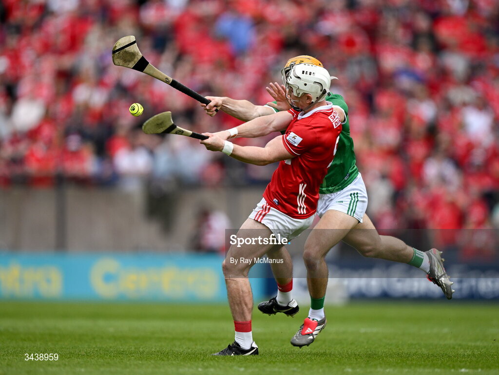 26 April 2026; Tommy O'Connell of Cork clears under pressure from Adam English of Limerick during the Munster GAA Senior Hurling Championship Round 2 match between Cork and Limerick at SuperValu Páirc Uí Chaoimh in Cork. Photo by Ray McManus/Sportsfile