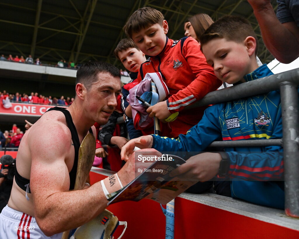 26 April 2026; Seán O'Donoghue of Cork signs the match programme of a young supporter after the Munster GAA Senior Hurling Championship Round 2 match between Cork and Limerick at SuperValu Páirc Uí Chaoimh in Cork. Photo by Tom Beary/Sportsfile