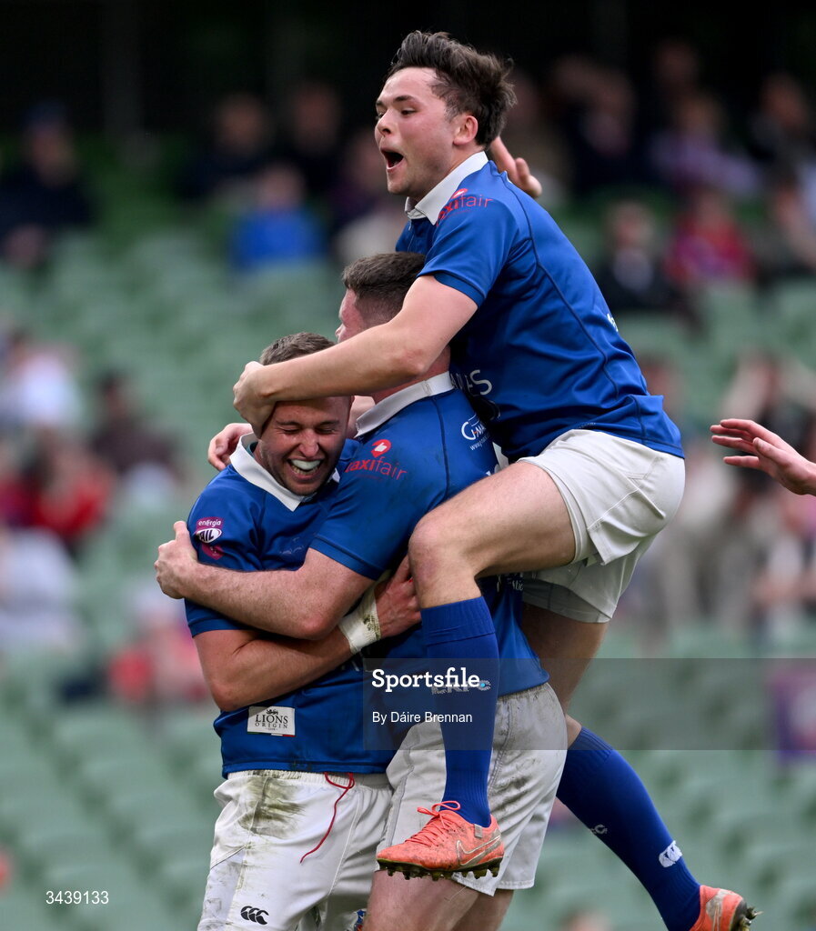 26 April 2026; Conor Dean of St Mary's College RFC, left, celebrates with team-mates Mick O'Gara, left, and Robert Gilsenan after scoring his side's fifth try during the Energia Men's All-Ireland League Division 1A final match between Clontarf FC and St Mary's College RFC at the Aviva Stadium in Dublin. Photo by Daire Brennan/Sportsfile