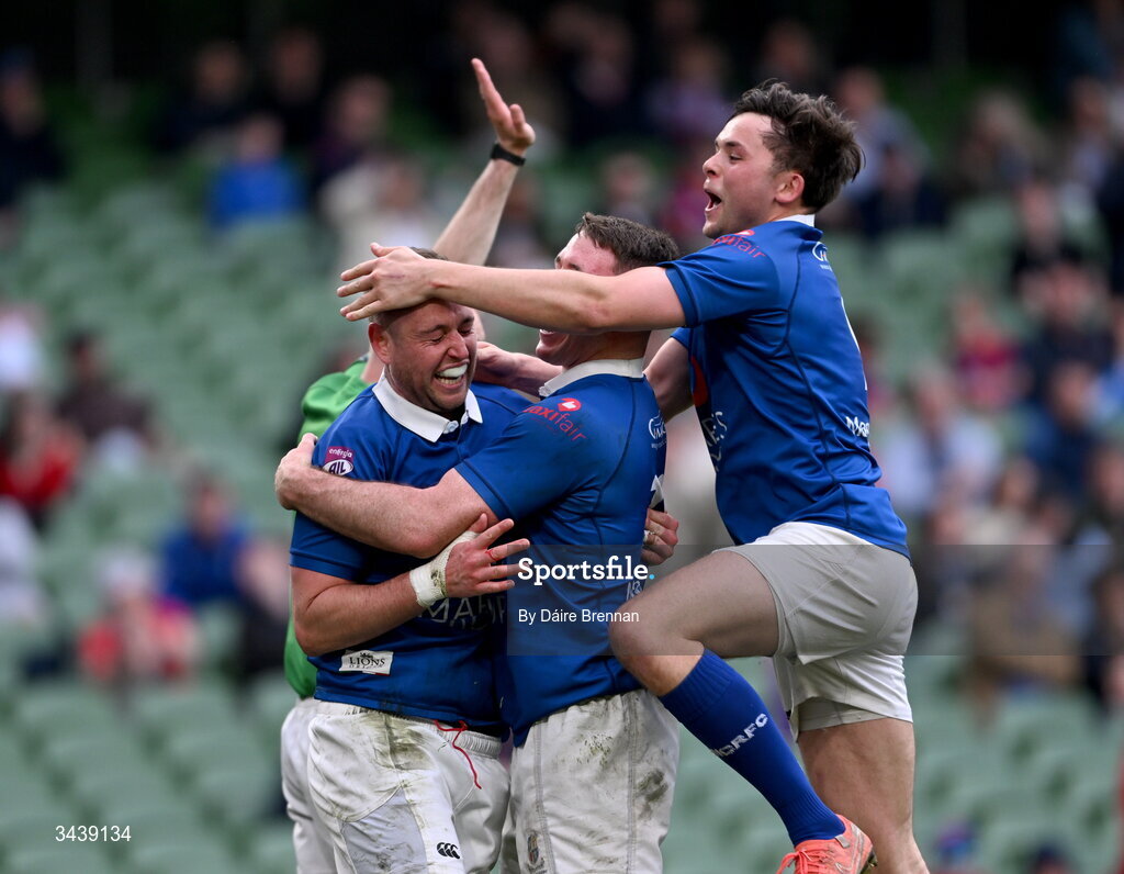 26 April 2026; Conor Dean of St Mary's College RFC, left, celebrates with team-mates Mick O'Gara, left, and Robert Gilsenan after scoring his side's fifth try during the Energia Men's All-Ireland League Division 1A final match between Clontarf FC and St Mary's College RFC at the Aviva Stadium in Dublin. Photo by Daire Brennan/Sportsfile