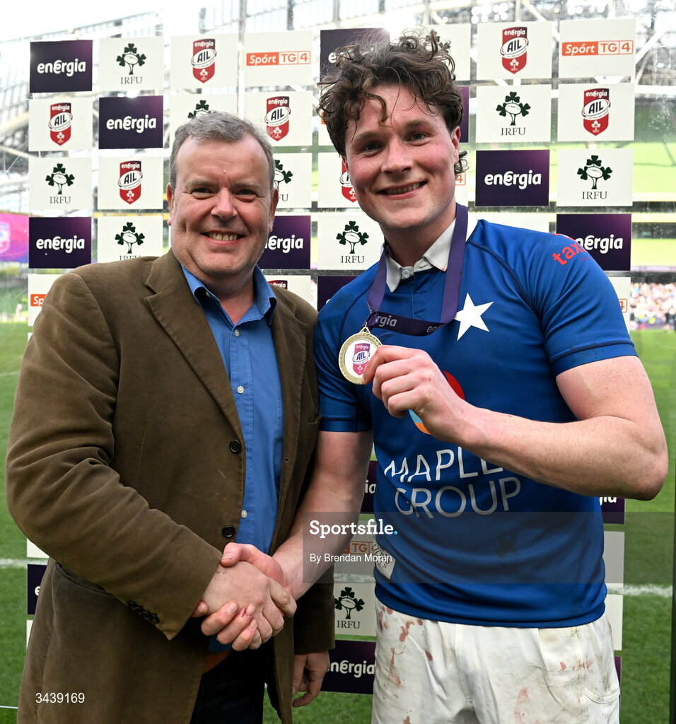 26 April 2026; Myles Carey of St Mary's College RFC is presented with the Energia Player of the Match by ROI residential business & marketing director at Energia Gary Ryan after the Energia Men's All-Ireland League Division 1A final match between Clontarf FC and St Mary's College RFC at the Aviva Stadium in Dublin. Photo by Brendan Moran/Sportsfile