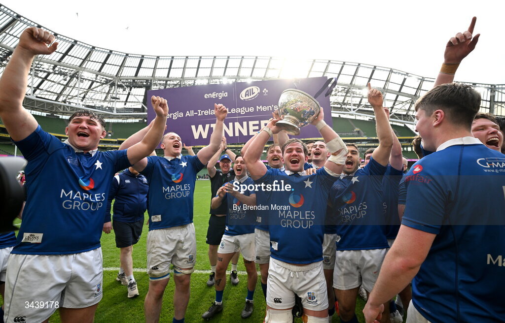 26 April 2026; Ethan Baxter of St Mary's College RFC and teammates celebrate with the trophy after the Energia Men's All-Ireland League Division 1A final match between Clontarf FC and St Mary's College RFC at the Aviva Stadium in Dublin. Photo by Brendan Moran/Sportsfile