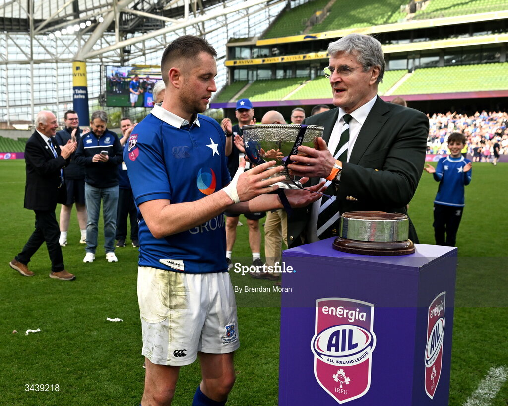 26 April 2026; St Mary's College RFC captain Conor Dean is presented with the Energia Men's AIL Division 1A trophy by IRFU president John O'Driscoll after during the Energia Men's All-Ireland League Division 1A final match between Clontarf FC and St Mary's College RFC at the Aviva Stadium in Dublin. Photo by Brendan Moran/Sportsfile
