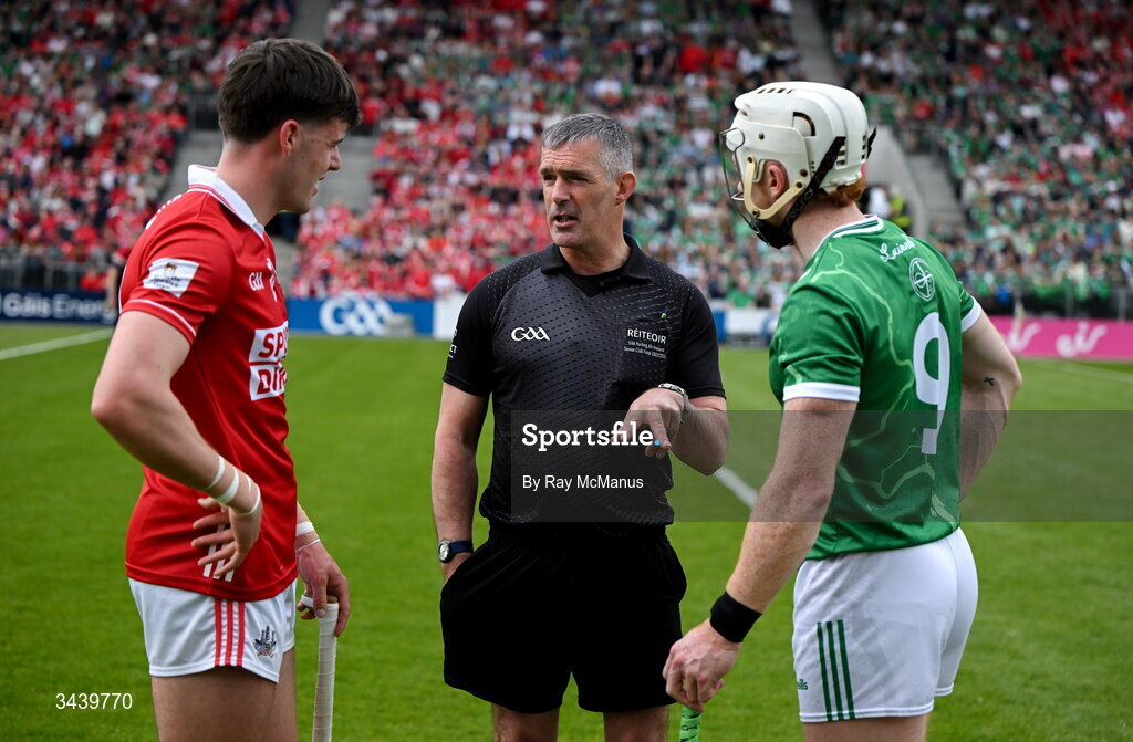 26 April 2026; Referee James Owens with the two captains, Darragh Fitzgibbon of Cork and Cian Lynch of Limerick, before  the Munster GAA Senior Hurling Championship Round 2 match between Cork and Limerick at SuperValu Páirc Uí Chaoimh in Cork. Photo by Ray McManus/Sportsfile