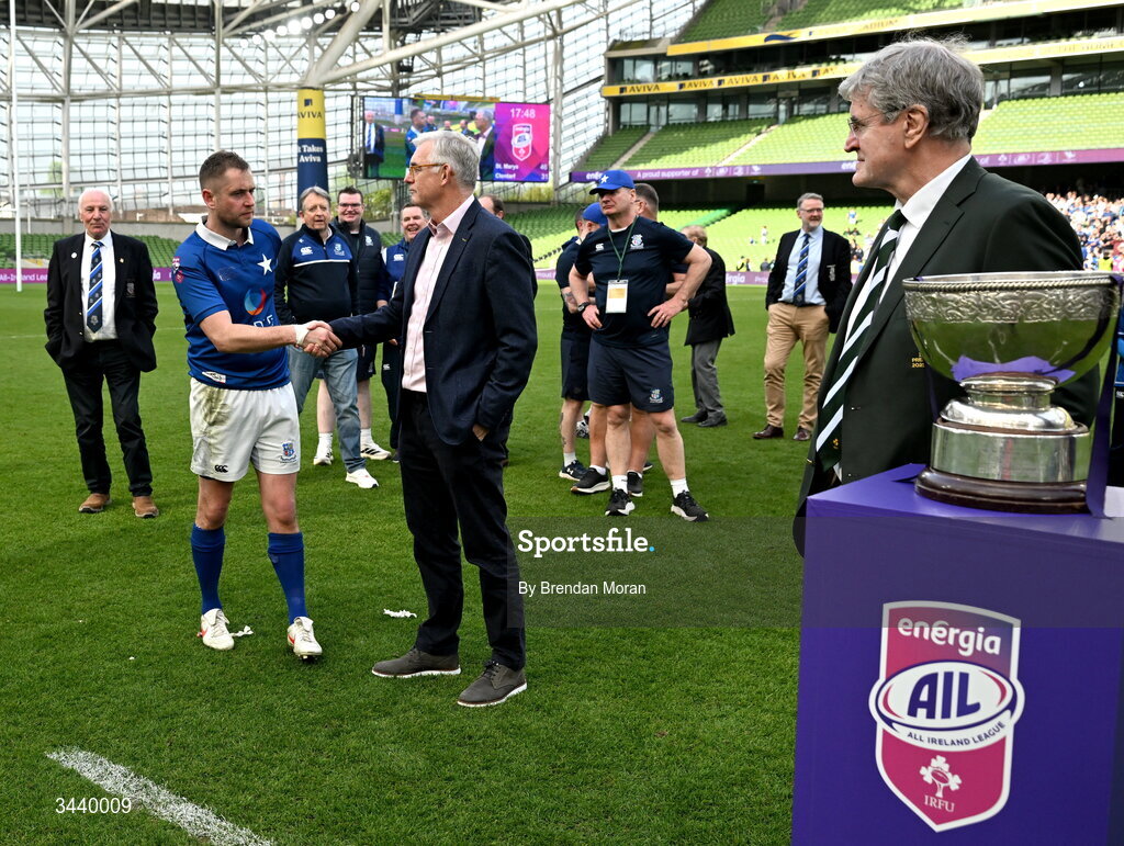 26 April 2026; St Mary's College RFC captain Conor Dean is congratulated by Energia Group managing director Gary Ryan before being presented with the Energia Men's AIL Division 1A trophy by IRFU president John O'Driscoll after the Energia Men's All-Ireland League Division 1A final match between Clontarf FC and St Mary's College RFC at the Aviva Stadium in Dublin. Photo by Brendan Moran/Sportsfile