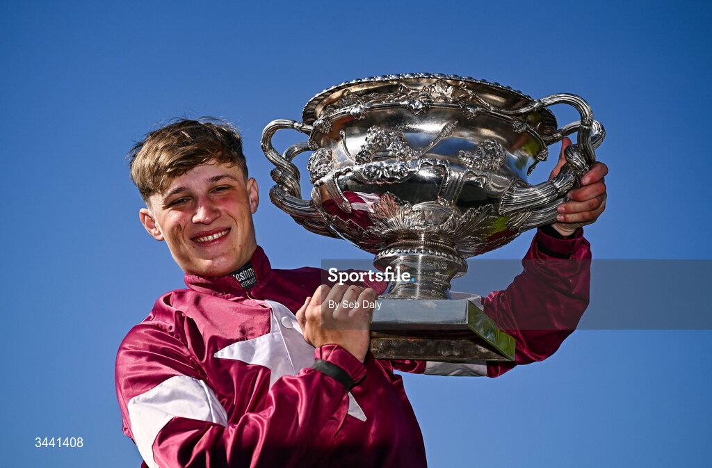 29 April 2026; Jockey Josh Halford celebrates with the trophy after winning the Race & Stay At Punchestown Champion INH Flat Race on With Nolimit during day two of the Punchestown Festival at Punchestown Racecourse in Kildare. Photo by Seb Daly/Sportsfile
