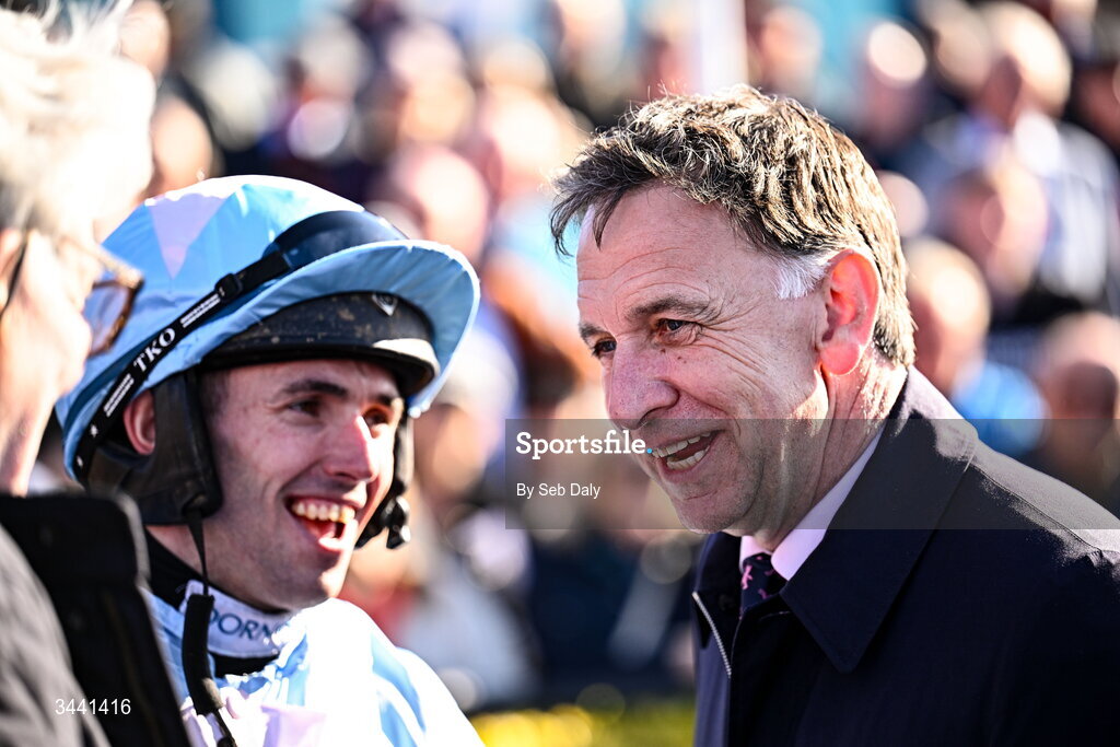 29 April 2026; Winning trainer Henry De Bromhead with jockey Darragh O'Keeffe after sending out Nouvotic to win the Colm Quinn BMW Handicap Steeplechase during day two of the Punchestown Festival at Punchestown Racecourse in Kildare. Photo by Seb Daly/Sportsfile