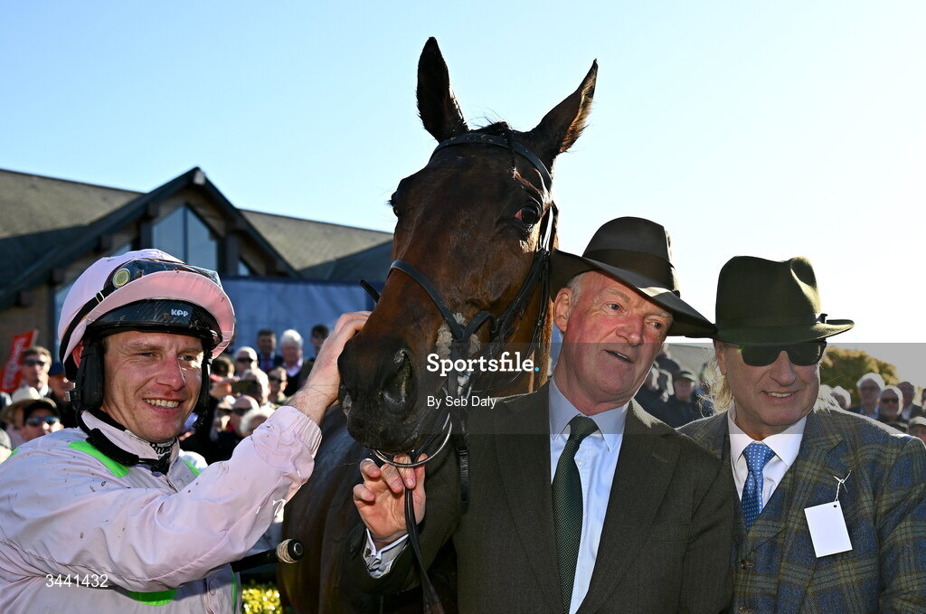 29 April 2026; Jockey Paul Townend, trainer Willie Mullins, centre, and owner Rich Ricci celebrate with Gaelic Warrior after winning the Ladbrokes Punchestown Gold Cup during day two of the Punchestown Festival at Punchestown Racecourse in Kildare. Photo by Seb Daly/Sportsfile