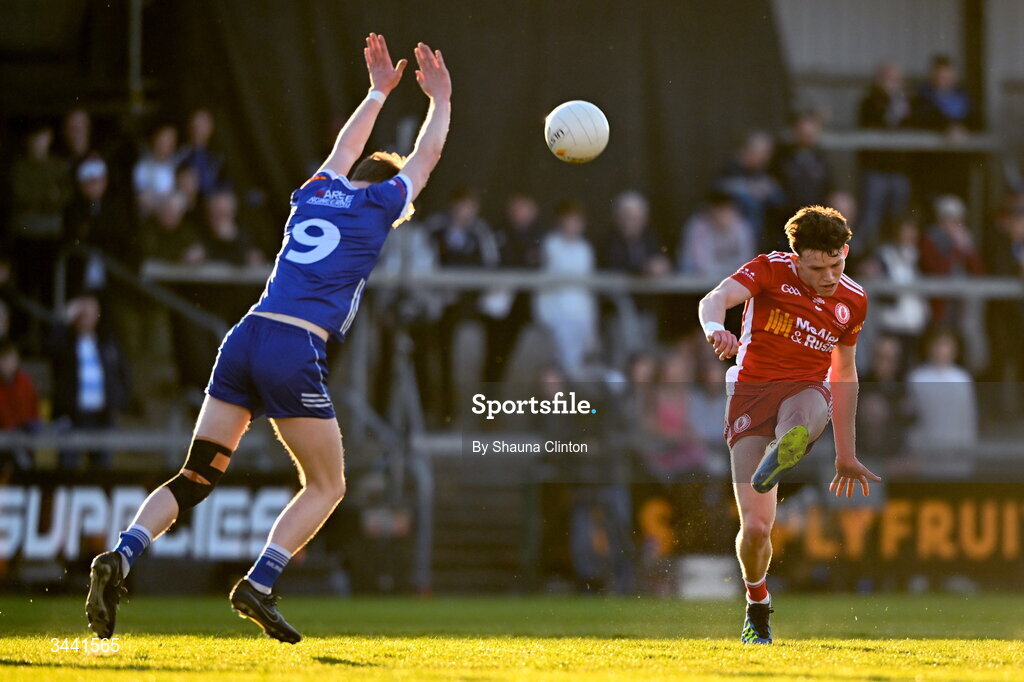 29 April 2026; Aodhán Quinn of Tyrone kicks a score despite the efforts of Matthew Carolan of Monaghan during the Dalata Hotel Group Ulster U20 Football Championship final match between Monaghan and Tyrone at BOX-IT Athletic Grounds in Armagh. Photo by Shauna Clinton/Sportsfile