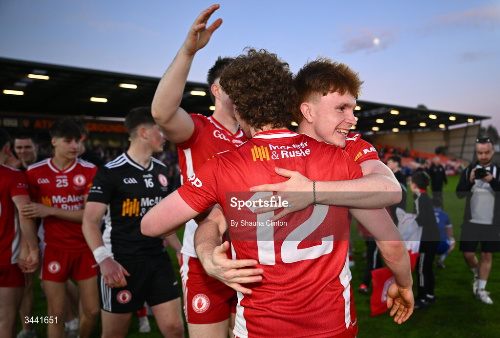 29 April 2026; Tyrone players Turlough Muldoon, left, and Correy Bell celebrate after their side's victory in the Dalata Hotel Group Ulster U20 Football Championship final match between Monaghan and Tyrone at BOX-IT Athletic Grounds in Armagh. Photo by Shauna Clinton/Sportsfile