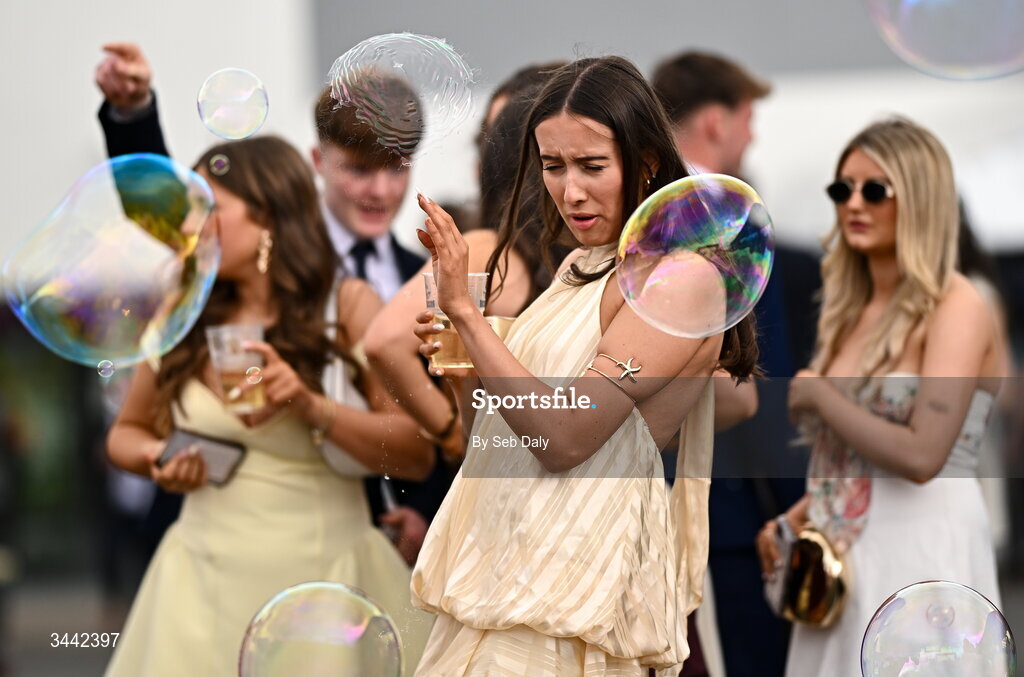 1 May 2026; A racegoer tries to avoid the bubbles ahead of racing on day four of the Punchestown Festival at Punchestown Racecourse in Kildare. Photo by Seb Daly/Sportsfile