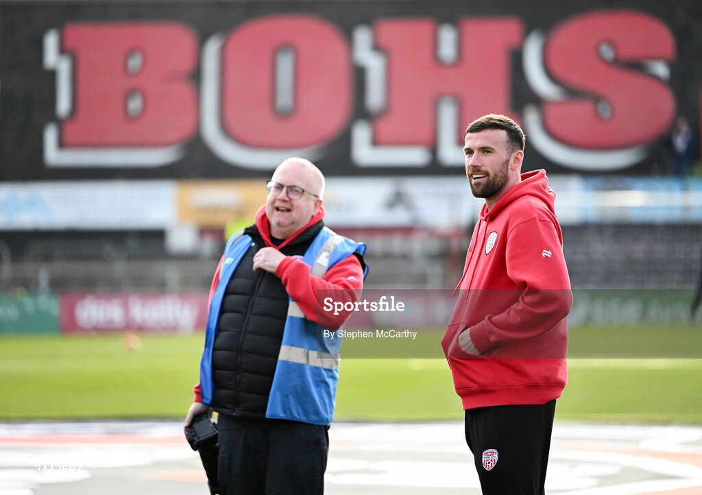 1 May 2026; Patrick McClean of Derry City and club photographer Kevin Morrison before the SSE Airtricity Men's Premier Division match between Bohemians and Derry City at Dalymount Park in Dublin. Photo by Stephen McCarthy/Sportsfile
