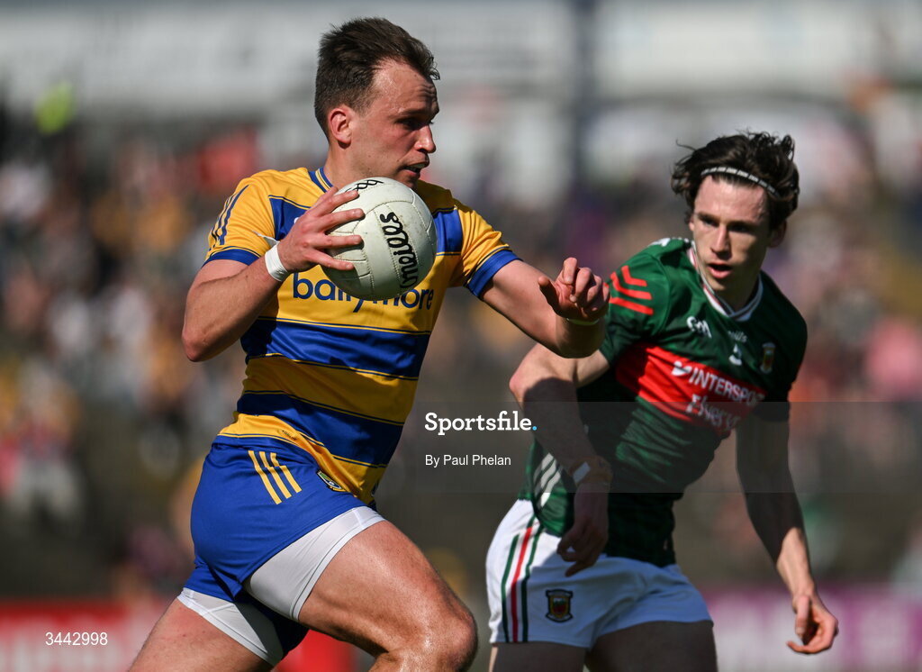 26 April 2026; Enda Smith of Roscommon in action against Sam Callinan of Mayo during the Connacht GAA Football Senior Championship semi-final match between Mayo and Roscommon at Hastings Insurance MacHale Park in Castlebar, Mayo. Photo by Paul Phelan/Sportsfile