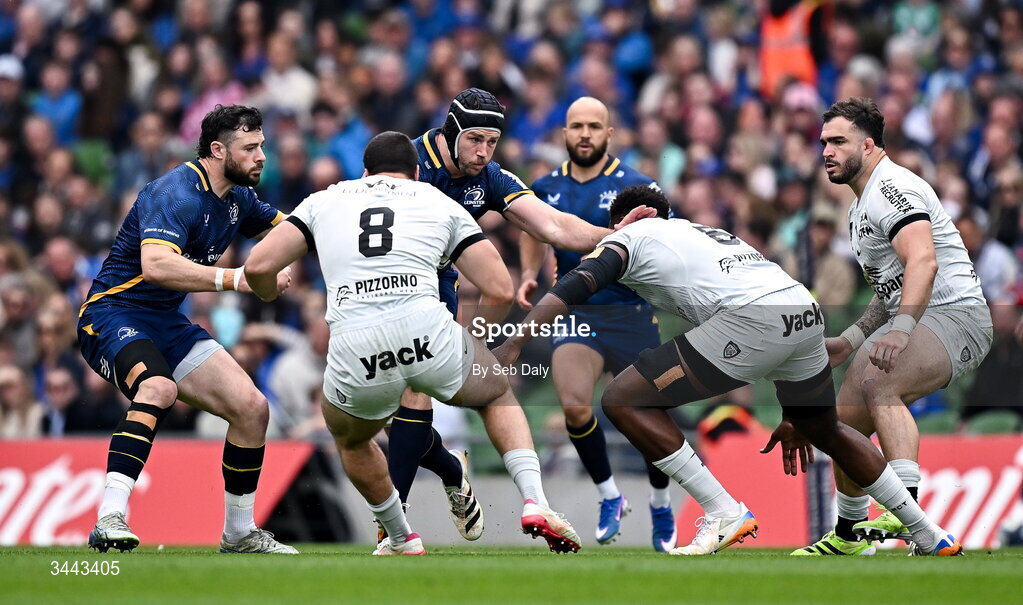 2 May 2026; Caelan Doris of Leinster is tackled by Mikheil Shioshvili, 8, and Junior Kpoku of RC Toulon during the Investec Champions Cup semi-final match between Leinster and RC Toulon at the Aviva Stadium in Dublin. Photo by Seb Daly/Sportsfile
