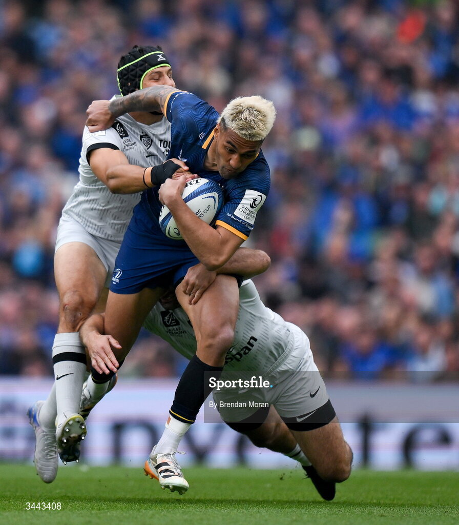 2 May 2026; Rieko Ioane of Leinster is tackled by Jérémy Sinzelle, left, and Nacho Brex of RC Toulon during the Investec Champions Cup semi-final match between Leinster and RC Toulon at the Aviva Stadium in Dublin. Photo by Brendan Moran/Sportsfile