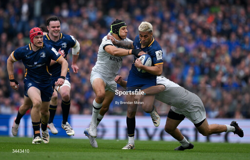 2 May 2026; Rieko Ioane of Leinster is tackled by Jérémy Sinzelle, left, and Nacho Brex of RC Toulon during the Investec Champions Cup semi-final match between Leinster and RC Toulon at the Aviva Stadium in Dublin. Photo by Brendan Moran/Sportsfile