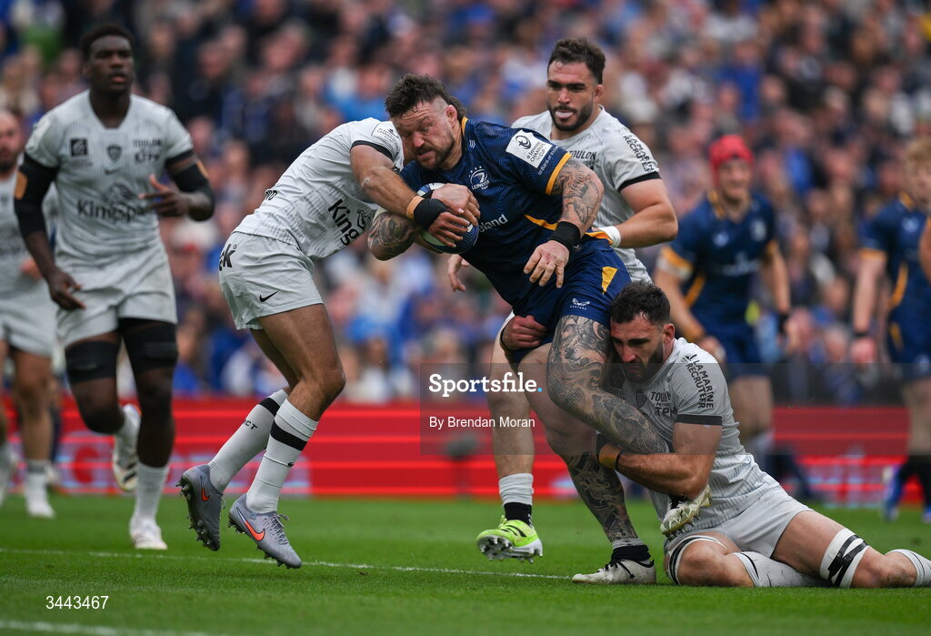 2 May 2026; Andrew Porter of Leinster is tackled by Melvyn Jaminet, left, and Charles Ollivon of RC Toulon during the Investec Champions Cup semi-final match between Leinster and RC Toulon at the Aviva Stadium in Dublin. Photo by Brendan Moran/Sportsfile