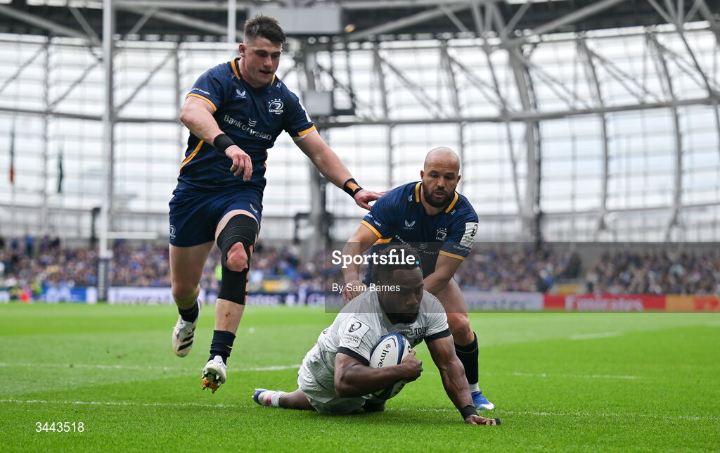 2 May 2026; Setariki Tuicuvu of RC Toulon dives over to score his side's first try despite the efforts of Jamison Gibson-Park, right, and Dan Sheehan of Leinster during the Investec Champions Cup semi-final match between Leinster and RC Toulon at the Aviva Stadium in Dublin. Photo by Sam Barnes/Sportsfile