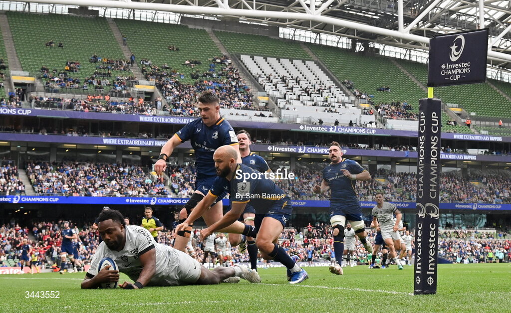 2 May 2026; Setariki Tuicuvu of RC Toulon dives over to score his side's first try despite the efforts of Jamison Gibson-Park, right, and Dan Sheehan of Leinster during the Investec Champions Cup semi-final match between Leinster and RC Toulon at the Aviva Stadium in Dublin. Photo by Sam Barnes/Sportsfile