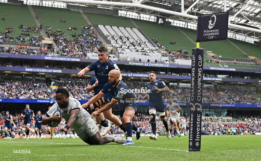 2 May 2026; Setariki Tuicuvu of RC Toulon dives over to score his side's first try despite the efforts of Jamison Gibson-Park, right, and Dan Sheehan of Leinster during the Investec Champions Cup semi-final match between Leinster and RC Toulon at the Aviva Stadium in Dublin. Photo by Sam Barnes/Sportsfile