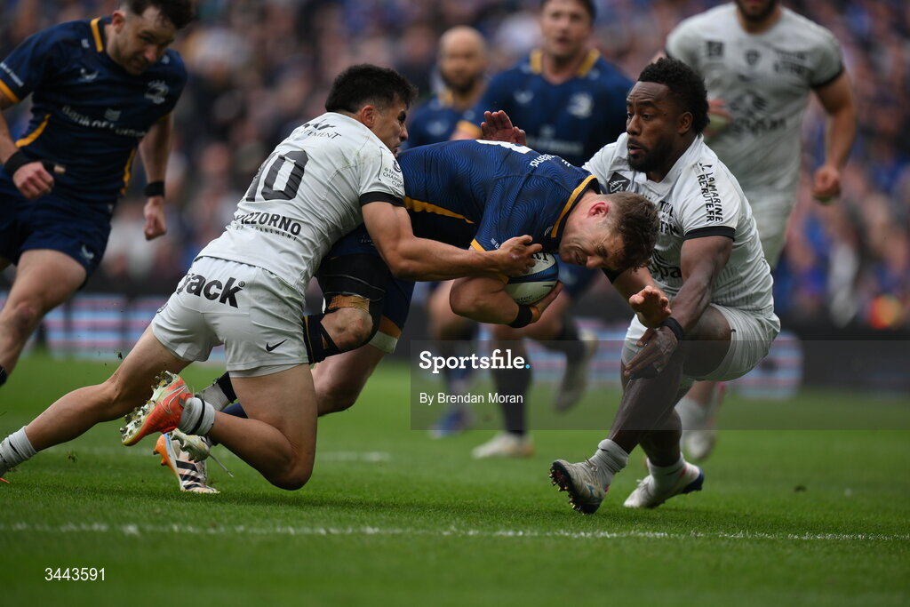 2 May 2026; Garry Ringrose of Leinster dives over to score his side's third try despite the efforts of Tomas Albornoz, left, and Setariki Tuicuvu of RC Toulon during the Investec Champions Cup semi-final match between Leinster and RC Toulon at the Aviva Stadium in Dublin. Photo by Brendan Moran/Sportsfile
