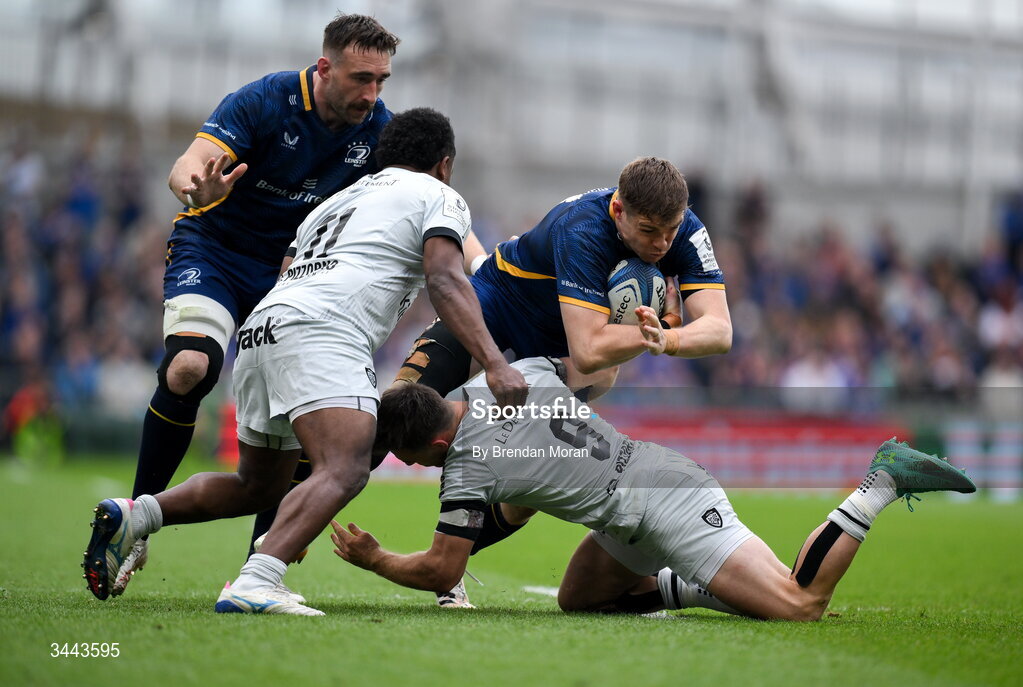 2 May 2026; Garry Ringrose of Leinster is tackled by Ben White of RC Toulon, right, during the Investec Champions Cup semi-final match between Leinster and RC Toulon at the Aviva Stadium in Dublin. Photo by Brendan Moran/Sportsfile