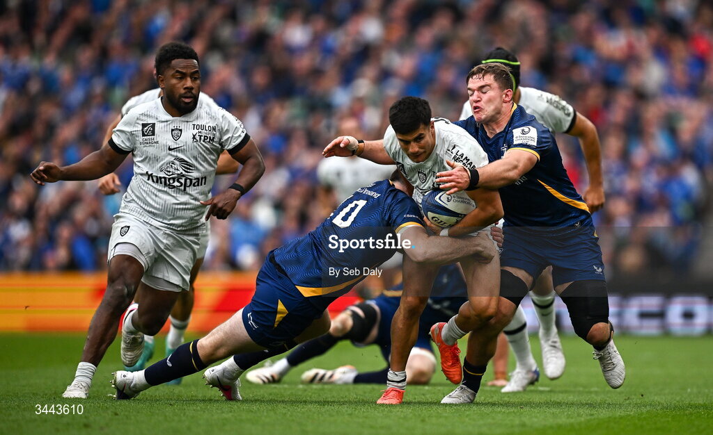 2 May 2026; Tomas Albornoz of RC Toulon is tackled by Harry Byrne, left, and Scott Penny of Leinster during the Investec Champions Cup semi-final match between Leinster and RC Toulon at the Aviva Stadium in Dublin. Photo by Seb Daly/Sportsfile